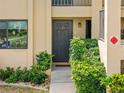 Condo front door with well-kept landscaping offering a welcoming entrance at 3221 White Ibis Ct # D1, Punta Gorda, FL 33950