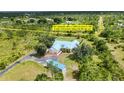 Gorgeous home with a metal roof, and a large lot that includes a riding trail in Prairie Creek Park at 5950 Cypress Grove Cir, Punta Gorda, FL 33982