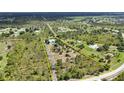 Home with a metal roof and a long driveway in Prairie Creek Park at 5950 Cypress Grove Cir, Punta Gorda, FL 33982