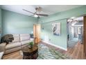 Comfortable living room with neutral furniture, ceiling fan, and an area rug with a leaf design at 1027 Coral Ridge Dr, Punta Gorda, FL 33950