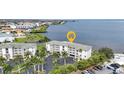 Waterfront condo complex, nestled amidst swaying palm trees, boasting scenic views and a convenient parking area at 1250 W Marion Ave # 333, Punta Gorda, FL 33950