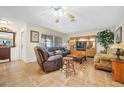 Comfortable living room features tile floors, large window, and ceiling fan at 2131 Amanda Dr, Sarasota, FL 34232