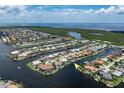 Aerial view of waterfront homes with access to a serene waterway at 2814 La Mancha Ct, Punta Gorda, FL 33950