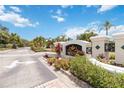 Serenade community sign with lush landscaping, gated entrance, and blue skies at 5146 Northridge Rd # 305, Sarasota, FL 34238