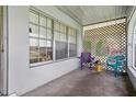 Cozy porch with lattice accents, seating, and natural light at 6196 Mayberry Ave, North Port, FL 34287