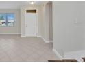Inviting foyer boasts neutral tile flooring, enhancing the entryway's bright and open feel at 200 Valdiva St, Punta Gorda, FL 33983