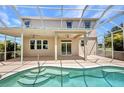 Relaxing screened-in pool with covered patio and ceiling fans offers a refreshing outdoor retreat at 200 Valdiva St, Punta Gorda, FL 33983