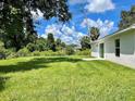 Expansive backyard with lush green grass, perfect for outdoor activities and relaxation at 3532 Richardson St, North Port, FL 34288