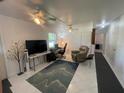 Bright living room featuring tile floors and ceiling fan at 2336 Picnic St, Port Charlotte, FL 33952