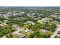 Aerial view of a property in a lush residential neighborhood at 1242 Orlando Blvd, Port Charlotte, FL 33952