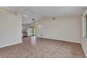 Open-concept living room featuring tile flooring and bright natural light at 1242 Orlando Blvd, Port Charlotte, FL 33952