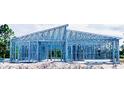New home construction site, steel framework displaying modern architecture at 12531 Siesta Dr, Punta Gorda, FL 33955