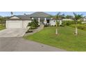 Stunning single-Gathering home with meticulously maintained landscaping and a spacious three-car garage at 12581 Eisenhower Dr, Port Charlotte, FL 33953