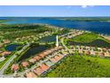 Aerial view of a charming neighborhood with waterfront homes and lush greenery, offering a serene and picturesque setting at 13136 N Marsh Dr, Port Charlotte, FL 33953