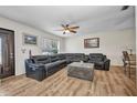 Inviting living room showcases a leather sofa, a unique coffee table, and bright, natural light at 1478 Harmony Dr, Port Charlotte, FL 33952