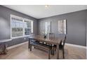 Elegant dining room featuring a modern table with bench seating, complemented by stylish decor and natural light at 16833 Terrapin Key Dr, Port Charlotte, FL 33953