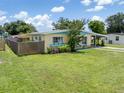 Charming single-story home boasts a lush front lawn and inviting curb appeal at 22341 Midway Blvd, Port Charlotte, FL 33952