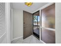 Open front door with storm door and natural light beaming in at 26336 Nadir Rd # 10, Punta Gorda, FL 33983
