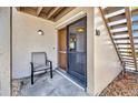 This condo features a quaint front patio with chair and access to stairs for easy access at 26336 Nadir Rd # 10, Punta Gorda, FL 33983
