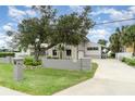 Charming home with stone accents, mature trees, and a well-maintained lawn for great outdoor living at 4460 Northshore Dr, Punta Gorda, FL 33980