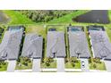 Aerial view showcasing neighboring houses with screened pools and a beautiful private backyard view at 11383 Burgundy Dr, Venice, FL 34293