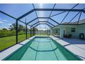 Private screened-in pool perfect for relaxation and recreation in a backyard oasis at 12112 Helios Ave, Port Charlotte, FL 33981