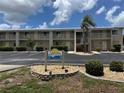 Lagoon Condominiums with a beautiful well kept lawn and landscaping. Great curb appeal at 1335 Mineo Dr # G, Punta Gorda, FL 33950