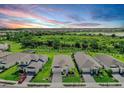 Aerial view of a well-planned neighborhood with lush greenery and community lake at 16336 Preservation Blvd, Punta Gorda, FL 33982
