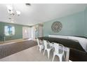 Dining area featuring modern lighting, seating, and an open feel at 21524 Edgewater Dr, Port Charlotte, FL 33952