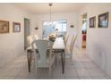 Formal dining room featuring a stylish table set and tile flooring at 2220 Broad Ranch Dr, Port Charlotte, FL 33948