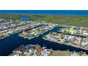 A scenic aerial view shows the home's prime waterfront location within a network of canals at 245 Lido Dr, Punta Gorda, FL 33950