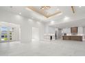 Bright and airy living space featuring modern finishes and expansive marble flooring at 245 Lido Dr, Punta Gorda, FL 33950