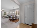 Open-concept living and dining area with neutral decor, carpet and lots of natural light at 8814 Tuscany Isles Dr, Punta Gorda, FL 33950