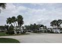 Community entrance with lush landscaping and well-maintained signage at 429 Cerromar Ln # 353, Venice, FL 34293