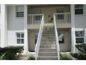 Exterior stairs leading to units above, with a well-maintained facade at 429 Cerromar Ln # 353, Venice, FL 34293