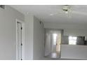 Open-concept living area with neutral paint and views to the kitchen at 429 Cerromar Ln # 353, Venice, FL 34293