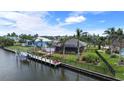 Wonderful waterfront home featuring a private dock, boat lift and well-manicured backyard at 8178 Arlewood Cir, Port Charlotte, FL 33981