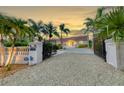 Elegant home with gated entry and meticulously landscaped grounds at 8035 Manasota Key Rd, Englewood, FL 34223