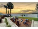 Relaxing waterfront fire pit area, perfect for enjoying sunsets and evenings at 8035 Manasota Key Rd, Englewood, FL 34223