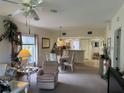 Bright living room with comfy seating and dining area at 8050 Memory Ln # 101, Rotonda West, FL 33947