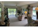Living room with sliding doors to patio at 8050 Memory Ln # 101, Rotonda West, FL 33947