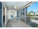 Screened balcony with table and chairs, ocean view at 7446 Palm Island Dr # 3514, Placida, FL 33946