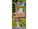 Aerial view showing home, pool, and large backyard at 745 Coral Way, Englewood, FL 34223