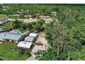 Aerial view of property with adjacent lot and pool at 1670 Lakeview Pl, Englewood, FL 34223