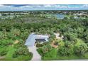 Single-story home with solar panels and tropical landscaping at 120 Barracuda Dr, Placida, FL 33946