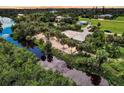 House on waterfront property with lush landscaping at 120 Barracuda Dr, Placida, FL 33946
