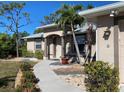 Welcoming front entrance with a landscaped walkway at 6 Transon Ln, Placida, FL 33946