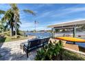 Private dock with seating area, boat lift and kayak at 15390 Ancel Cir, Port Charlotte, FL 33981