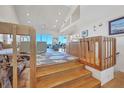 Wooden staircase leading to the living area at 13044 Via Cassia, Placida, FL 33946