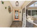 Inviting entryway with a welcome sign and tropical decor at 1361 Newton St, Port Charlotte, FL 33952